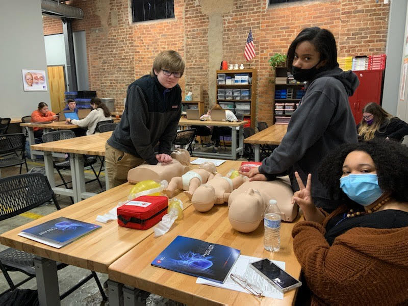 biotech students practicing cpr
