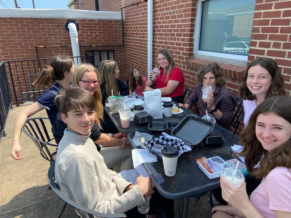 students eating lunch at outside tables