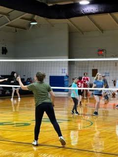students at volleyball net