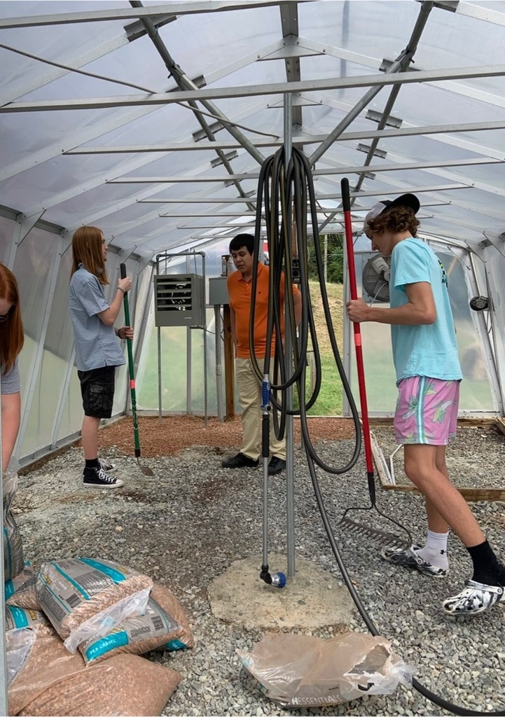 students working in greenhouse 